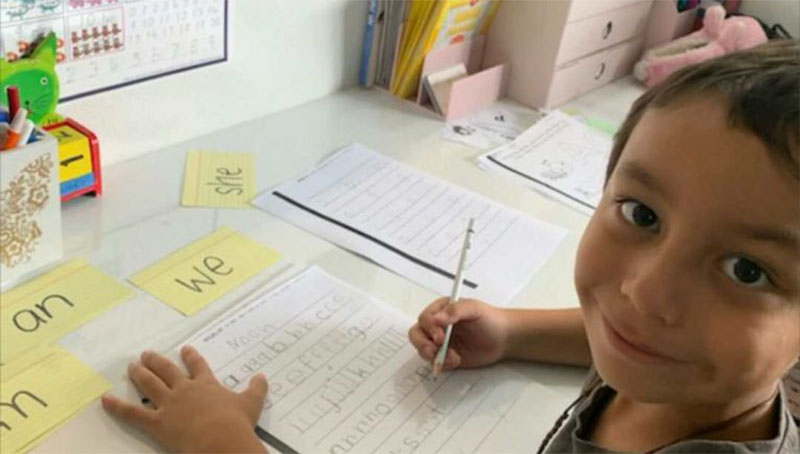 Student hard at work on his words