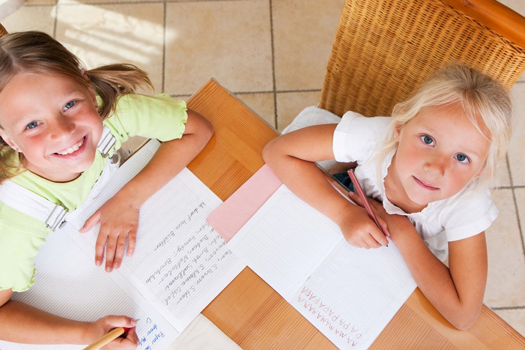 homeschooling - sisters working together